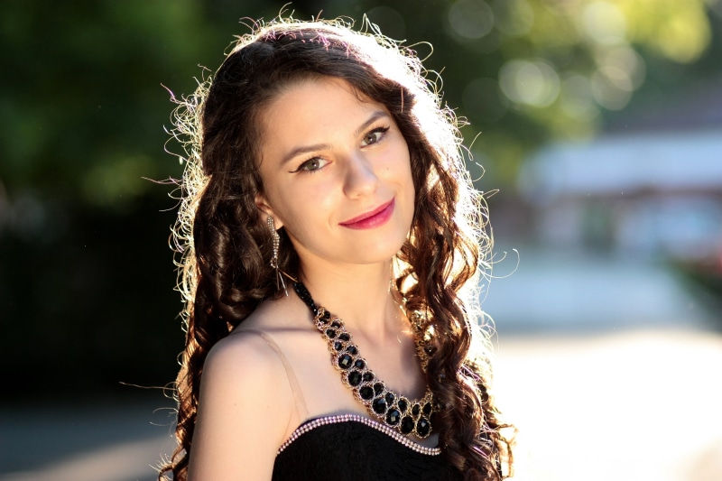 portrait, one Person, curly hair, lifestyles, headshot, black, top, looking at camera, brown eyes, fashion, beautiful people, brown hair, teenager, beautiful woman