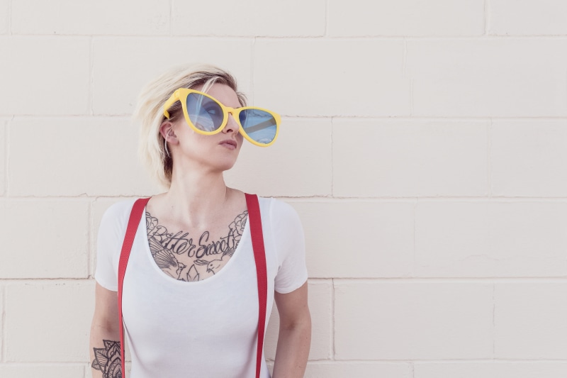 fun, looking At Camera, individuality, top, young women, portrait, beautiful woman, lifestyles, leisure activity, caucasian Ethnicity, sun, brick, waist up