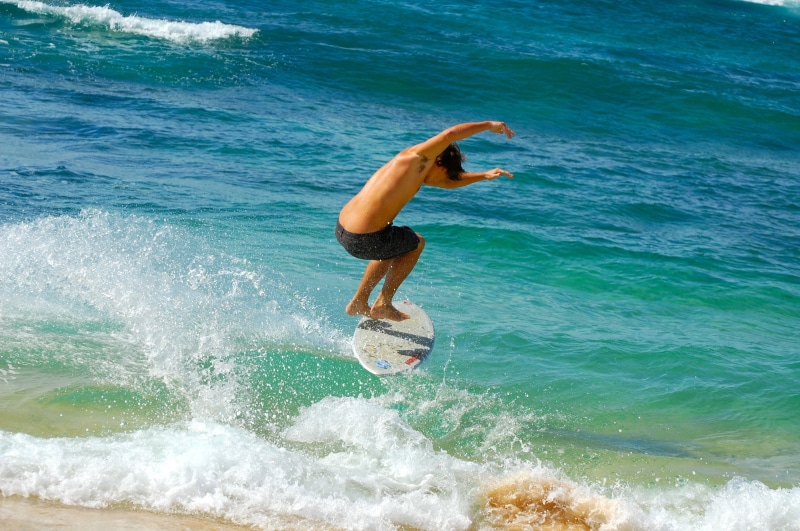 men, activity, surf, skimboarding, daytime, jump, tropical, blue, surfer, full length, hawaii, land, one person, water, people, beauty in nature, athlete