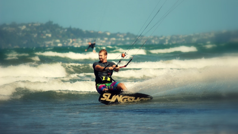 slingshot, black, day, sea, real people, transportation, lifestyles, beach, aquatic sport, motion, outdoors, full length, sky, nature, men, brown, kiteboarding