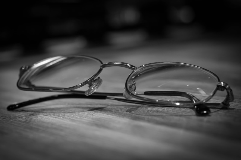 accessory, jewelry, optometrist, close-up, glass - material, single object, glasses, optical, indoors, wood - material, eyeglasses, transparent, sight