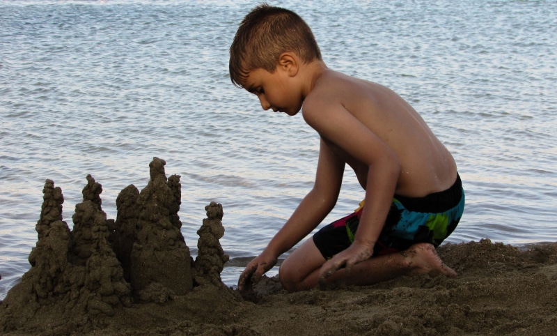 child, water, leisure activity, sand, outdoors, shorts, side view, beach, nature, rock - object, lifestyles, summer, playing, boys, shirtless, men, sea