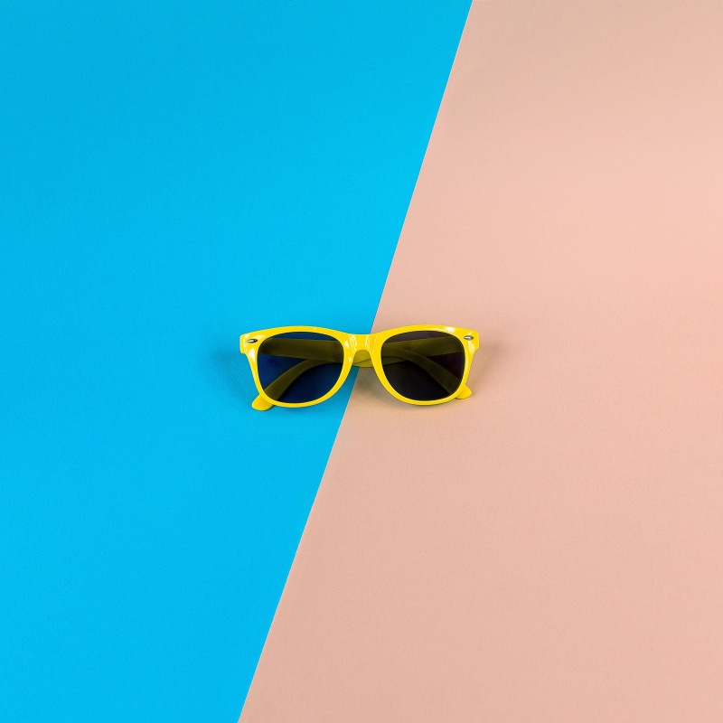 studio shot, red, pink, day, eyeglasses, fashion, blue, summer, 2K, close-up, blue background, pink color, turquoise colored, single object, copy space