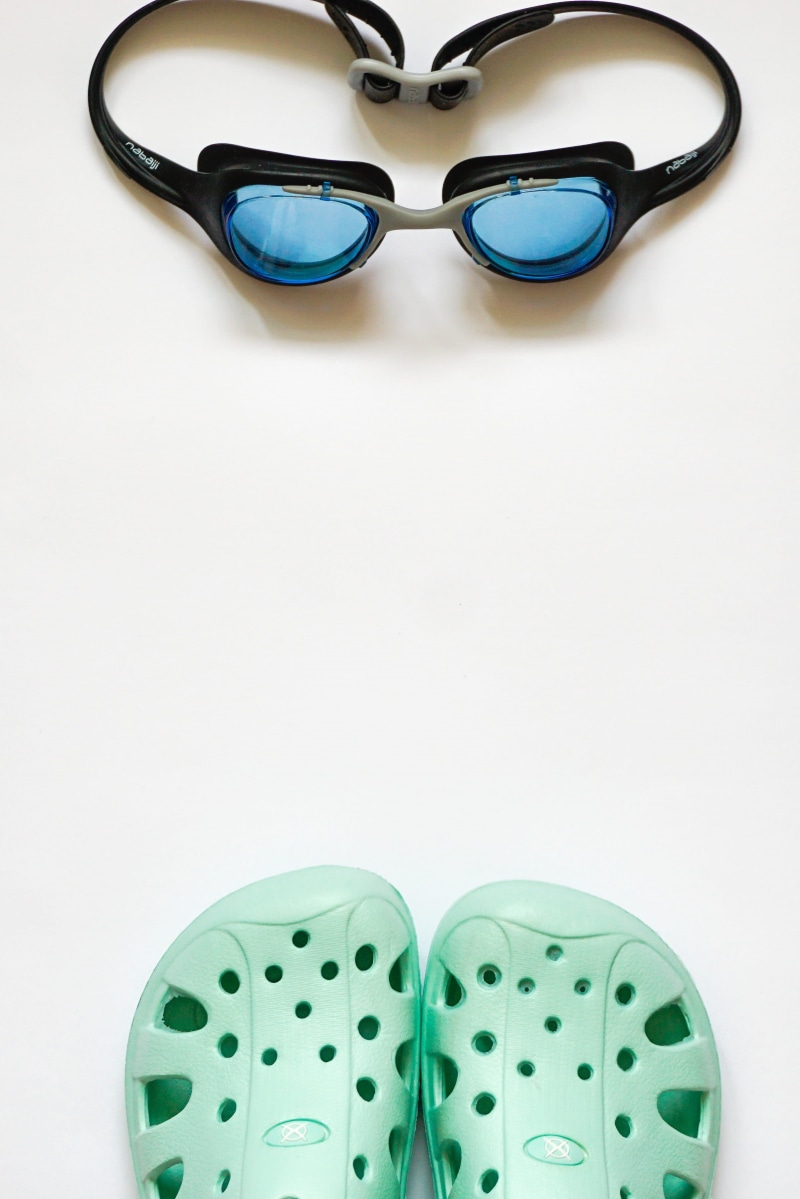 human body part, copy space, close-up, sunglasses, clothing, shoe, Swimming Goggles, small group of objects, swimming, eyesight, flip, Pool, safety, high angle view