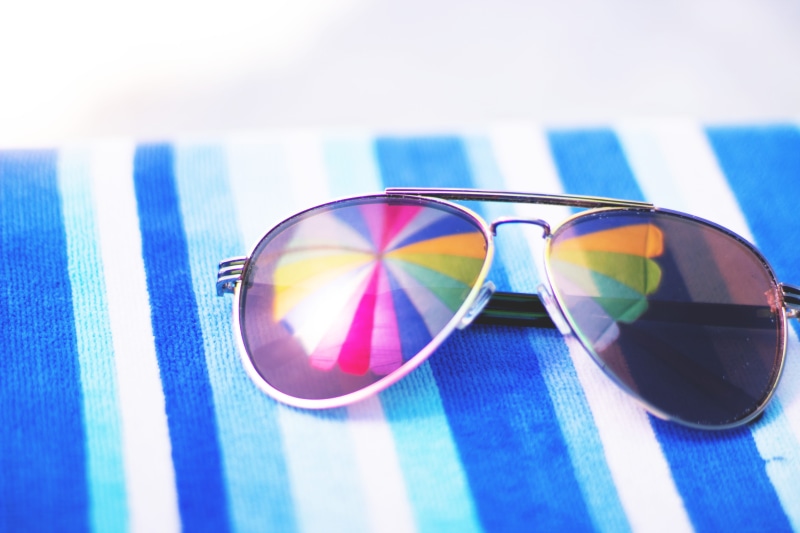 transparent, summer, multi colored, vacation, personal Accessory, close-up, holiday, sunlight, glass - material, beach, no people, clothing, focus on foreground