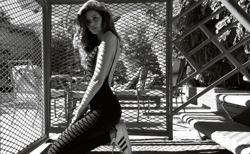 sitting, outdoors, one person, Designer, Fashion, blackandwhite, white, fence, Young, Woman, Clothing, clothes, hair, hairstyle, women, Adidas, Collection