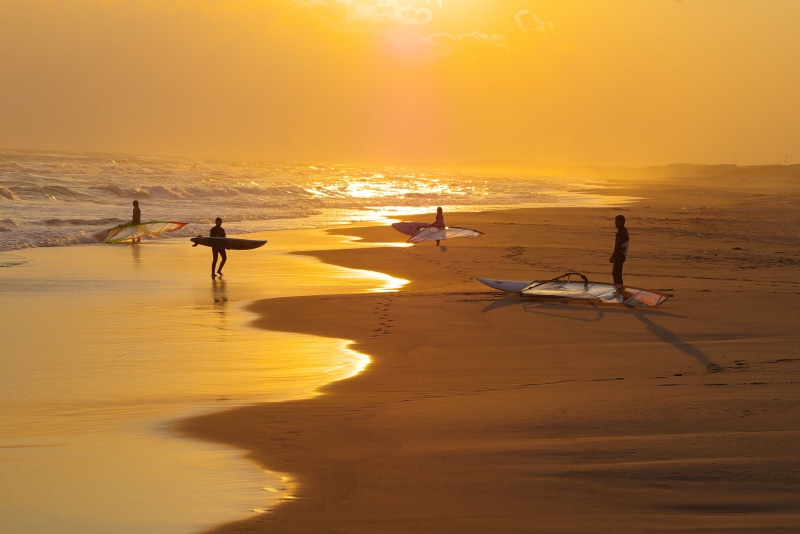 back Lit, tranquility, outdoors, tropical Climate, silhouette, SURFING, water, sky, lifestyles, sea, reflection, sun, sunset, fun, sunrise - Dawn, beach