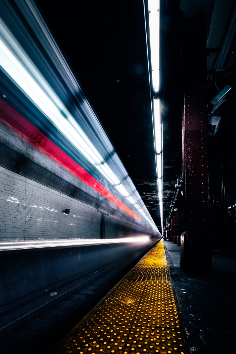lamps, transportation, motor vehicle, road, city street, no people, diminishing perspective, built structure, traffic, railway, subway train, illuminated