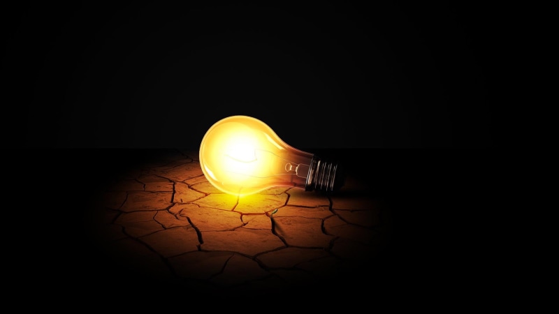 source of illumination, no people, filament, single object, celestial body, spotlight, sun, darkroom, energy, light bulb, star, glowing, lamp, dark, invention