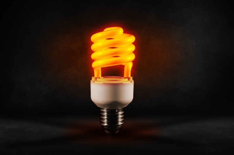 fuel and power generation, yellow, fire - natural phenomenon, indoors, flame, bulb, spiral, energy saving, studio shot, light bulb, 5K, sign, black background