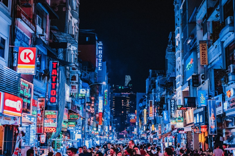 city street, neon, built structure, neonsign, people, building exterior, residential district, crowded, longexposure, group of people, organize, nightlife