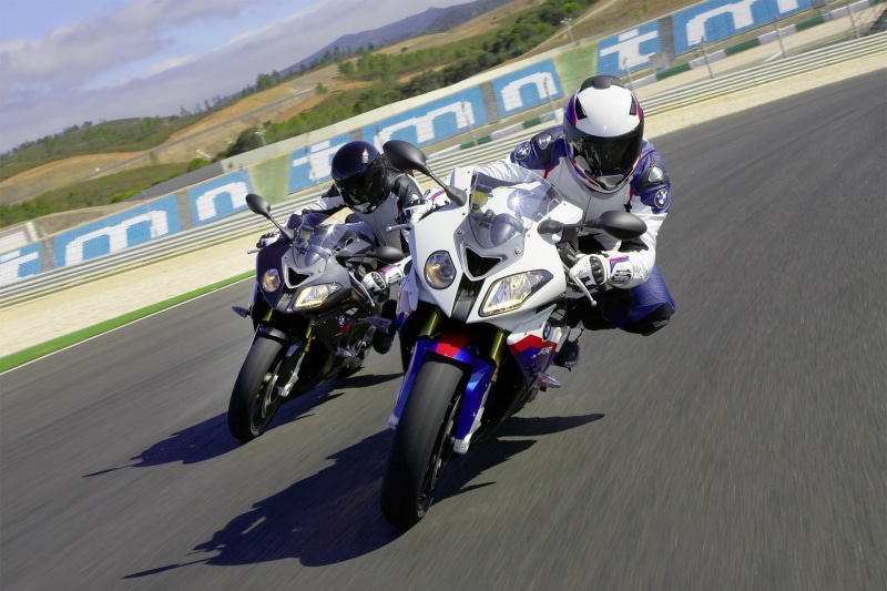 headwear, real people, riding, competition, mode of transportation, helmet, day, crash helmet, people, sport, group of people, motion, speed, transportation