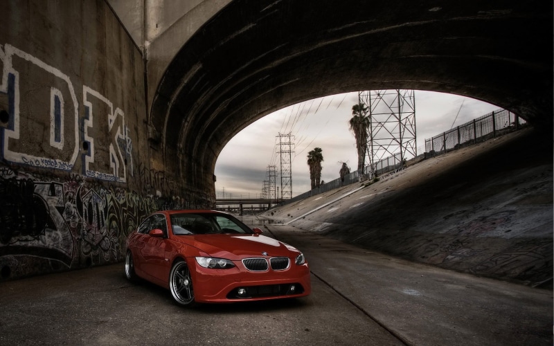 road, vehicle, red, tunnel, bridge, bridge - man made structure, mode of transportation, built structure, men, incidental people, real people, BMW, land vehicle