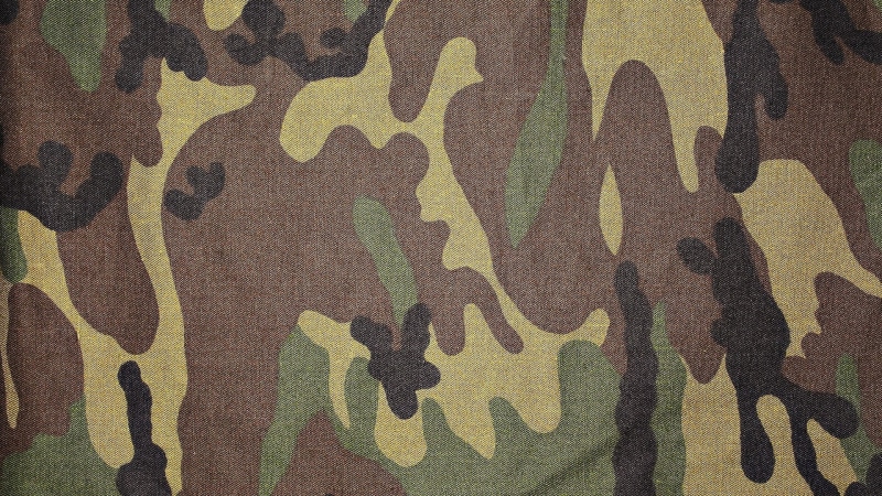 black color, black, outdoors, no people, gun, khaki, brown, surface, textile, day, abstract, camouflage Clothing, uniform, conflict, rough, close-up, military