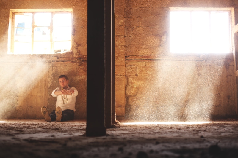 real people, lifestyles, through, particles, booze, dust, industrial, ground, depressed, sunshine, door, bottle, rays, person, one person, front view, males