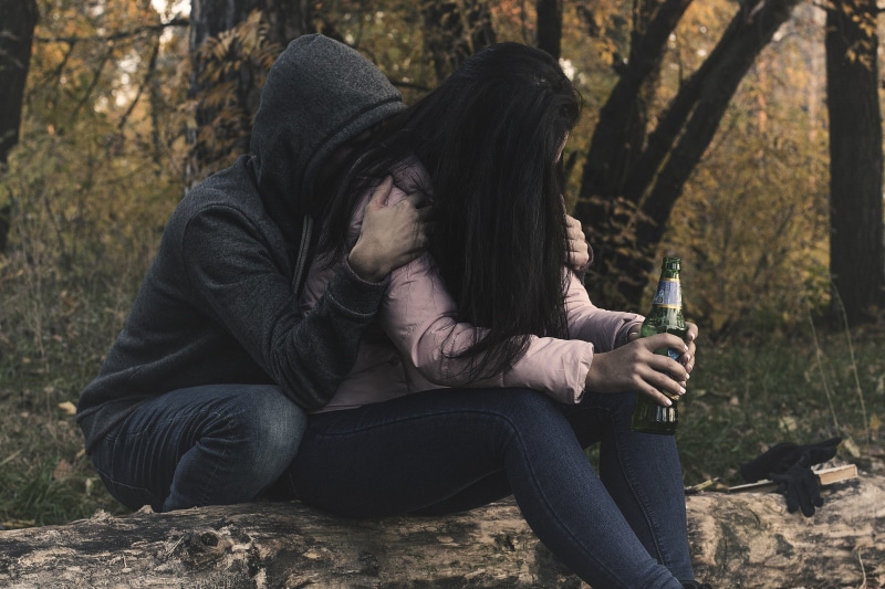 man, outdoors, tosca, real people, booze, women, abuse, front, drink, voltage, binge, woman, black, long, sad, holding, hairstyle, plant, person, gloomy