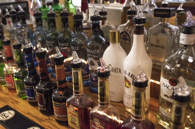 communication, brandy, food and drink, malibu, large group of objects, drink, booze, text, Glass Bottles, jacquins, indoors, bottles, gentleman jack, assorted