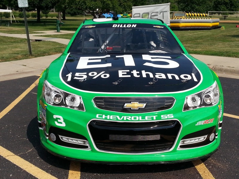 outdoors, western script, race car, city, day, sign, mode of transportation, transportation, turquoise colored, communication, racer, chevrolet ss, stock car