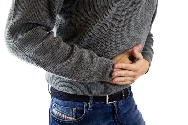 food intolerance, adult, hand, gray, disease, women, pain, finger, body part, appendicitis, casual clothing, white background, stomach acid, indoors, one person