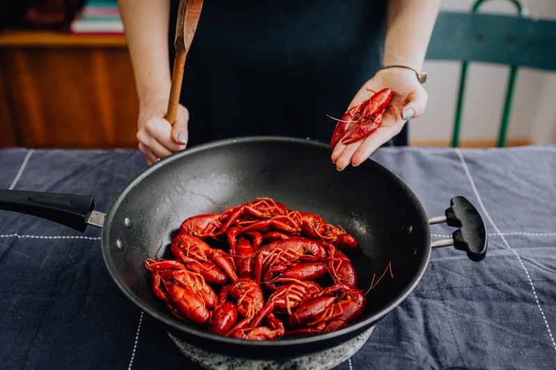 boiled, indoors, close-up, frying pan, holding, women, cook, crayfish, dinner, food and drink, hand, food, one person, crawfish, freshness, human body part