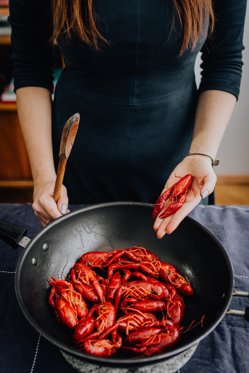 freshness, crawfish, food and drink, wellbeing, preparation, real people, midsection, boiled, indoors, domestic room, animal, holding, healthy eating, food