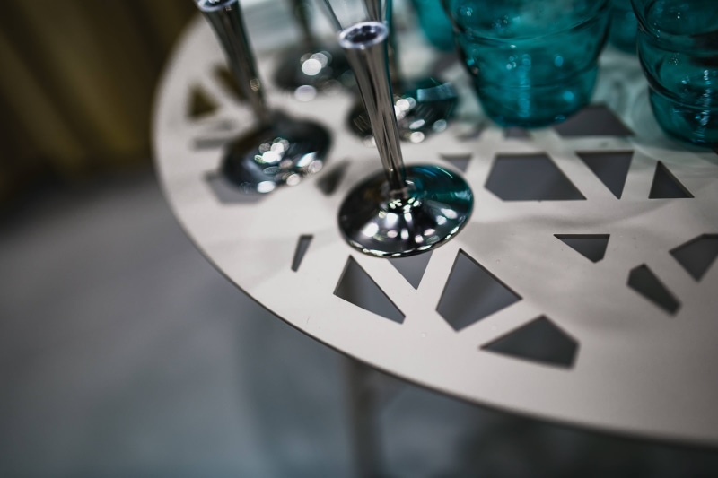 White, large group of objects, table, glassware, metal, glasses, luxury, drink, high angle view, art and craft, selective focus, glass - material, focus on foreground