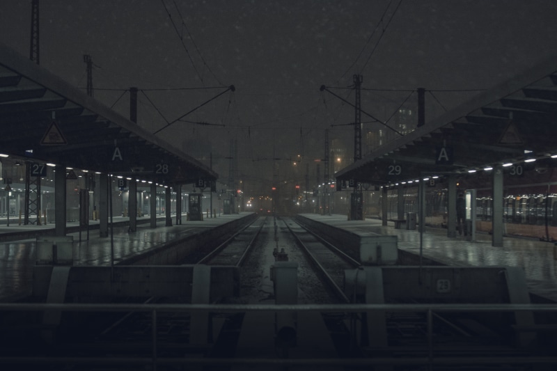 train - vehicle, outdoors, public transportation, end of the line, train station, direction, trainstation, night, snow, platform, diminishing perspective