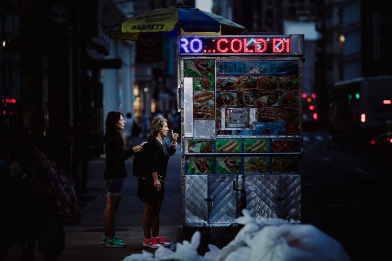 gritty, order, real people, city life, casual clothing, standing, truck, lifestyles, people, food, gray, food truck, nighttime, built structure, female