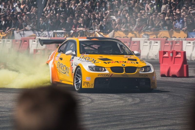 real people, gritty, transportation, competition, drifting, crowd, motor vehicle, small, toy car, taxi, toy, yellow taxi, group of people, incidental people