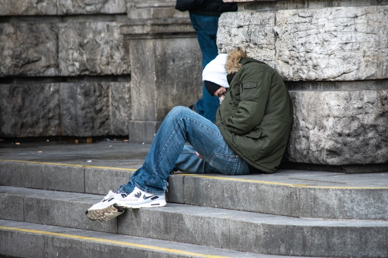 leisure activity, people, teenager, adult, poverty, men, relaxation, real people, lifestyles, jeans, adolescence, inequality, side view, homeless, sitting