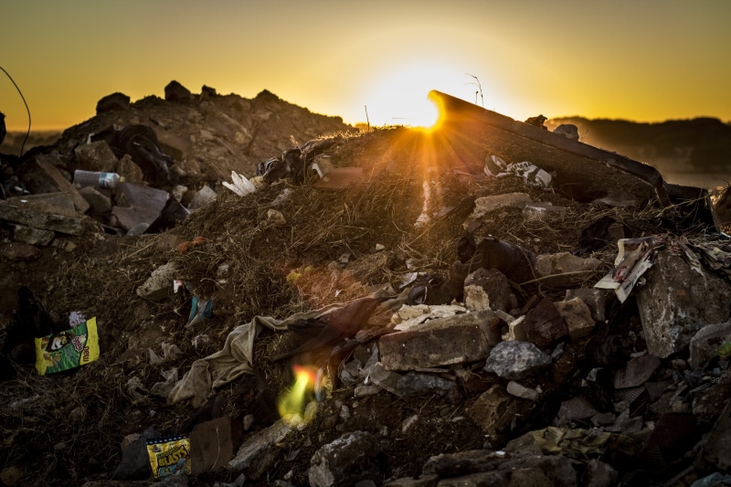 rubbish dump, african man, landfill, no people, environment, homeless, sunlight, rock, orange color, nature, scenics - nature, dump, sun, local, beauty in nature