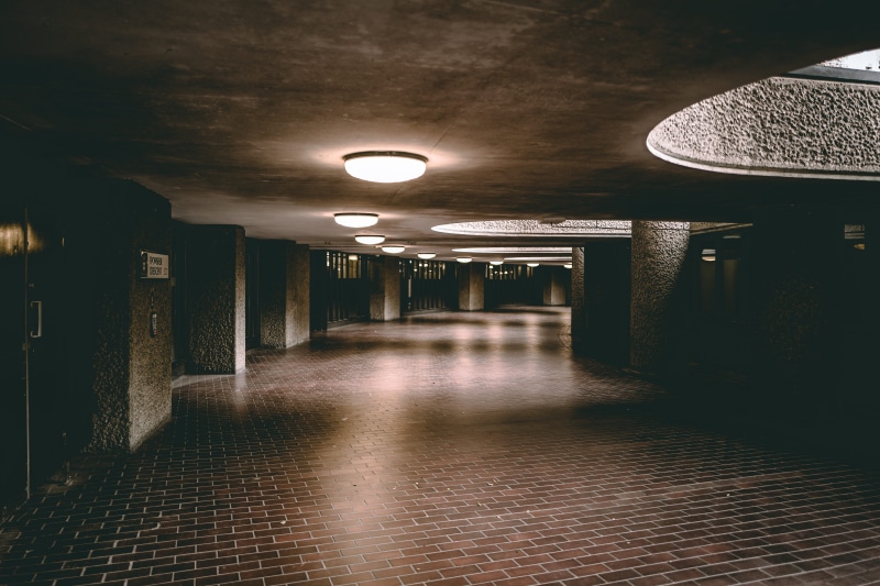 electric lamp, room, the way forward, corridor, indoors, barbican centre, uk, concrete, flooring, barbican, illuminated, long, ceiling, lobby, crypt, footpath