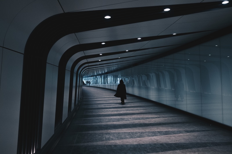 arcade, city tunnel, indoors, diminishing perspective, direction, one person, the way forward, corridor, silhouette, built structure, full length, subway Station