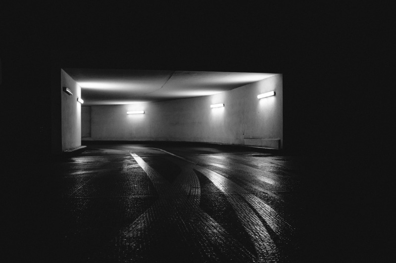 black and white, reflection, curve, underground, indoors, flooring, color, highway, tire track, empty, night, black Color, architecture, photo, ceiling