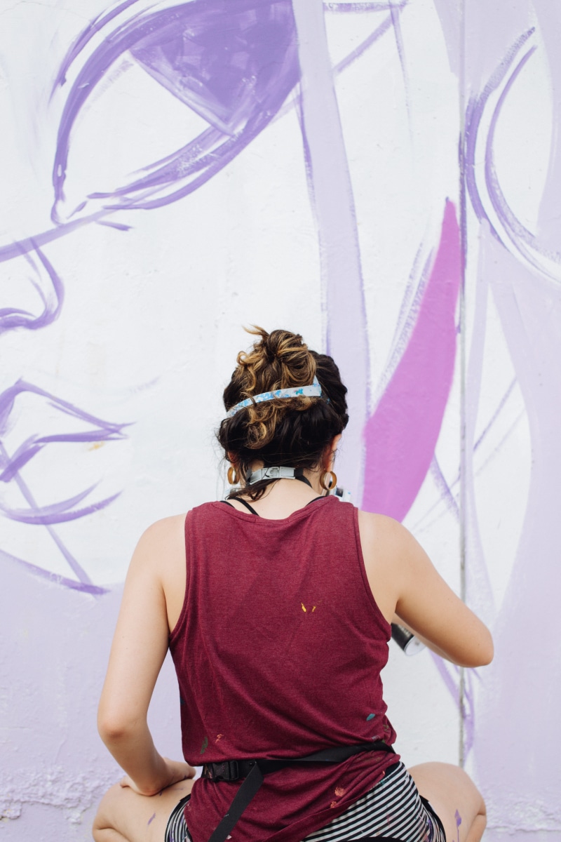young women, street art, one person, hair bun, clothing, three quarter length, street, teenager, real people, women, indoors, casual clothing, apparel