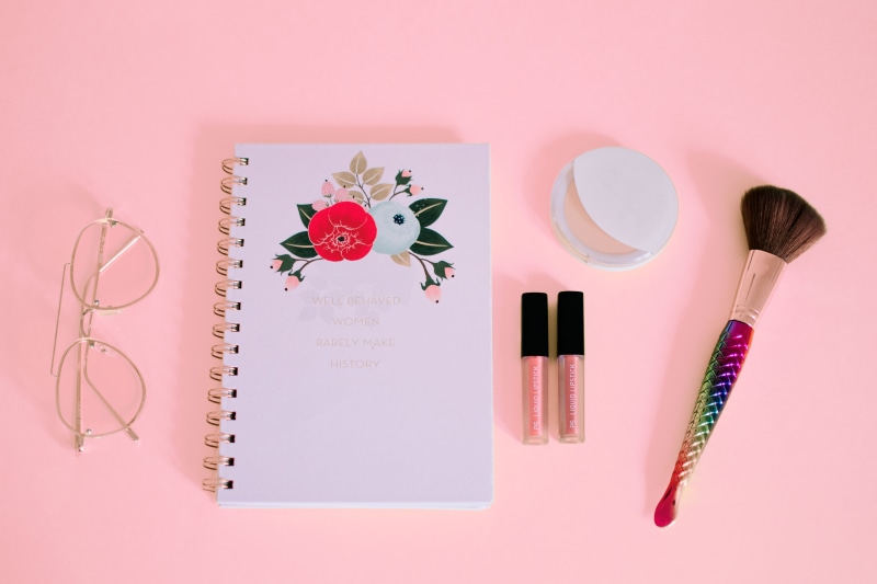 powder, table, pen, eyeglasses, flatlay, beauty product, make-up, pink background, studio shot, pink, pink color, paper, flower, flat, fashion, indoors