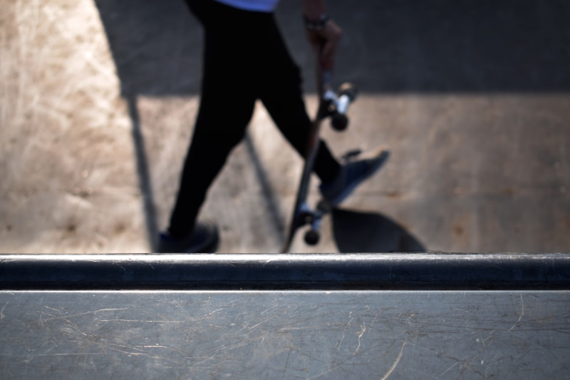 human foot, skatepark, day, real people, one person, scratch, walking, sunlight, well-dressed, shoe, lifestyles, outdoors, human limb, city, skateboard