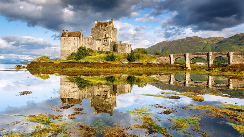 water, island, nature, building exterior, abbey, arch bridge, eilean donan castle, old ruin, built structure, outdoors, clouds, history, kyle of lochalsh
