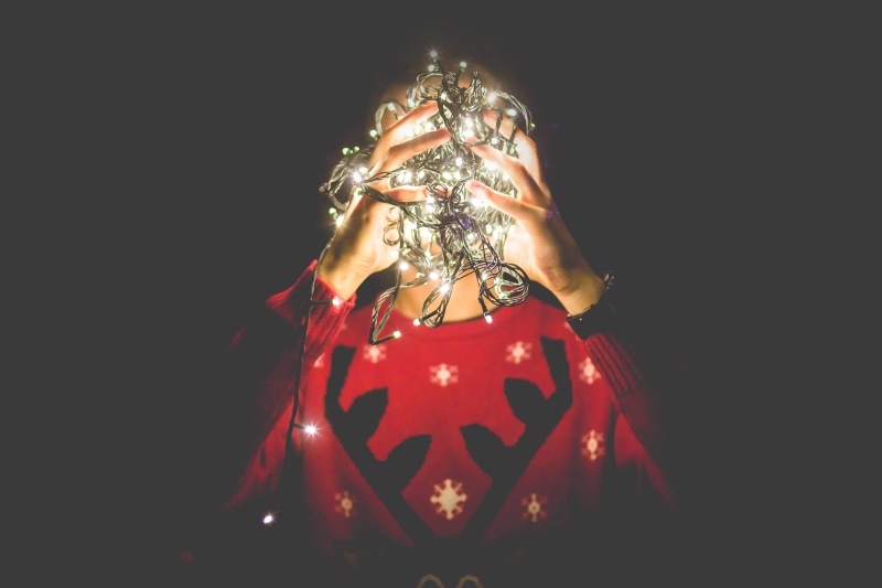 indoors, room for text, head, decoration, black background, front view, close-up, art and craft, instead, Tangled, one person, illuminated, red, celebration