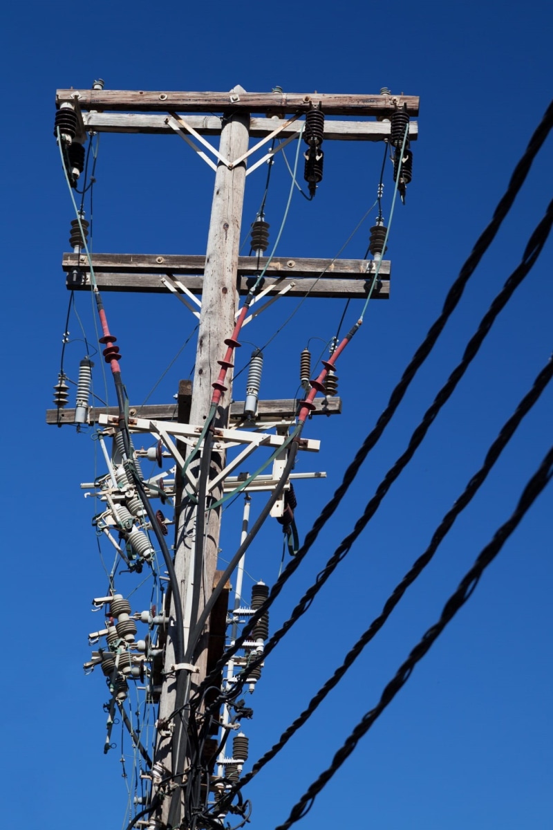 sky, electricity, outdoors, blue, electricity pylon, electrical equipment, line, power supply, wires, built structure, fuel and power generation, complexity