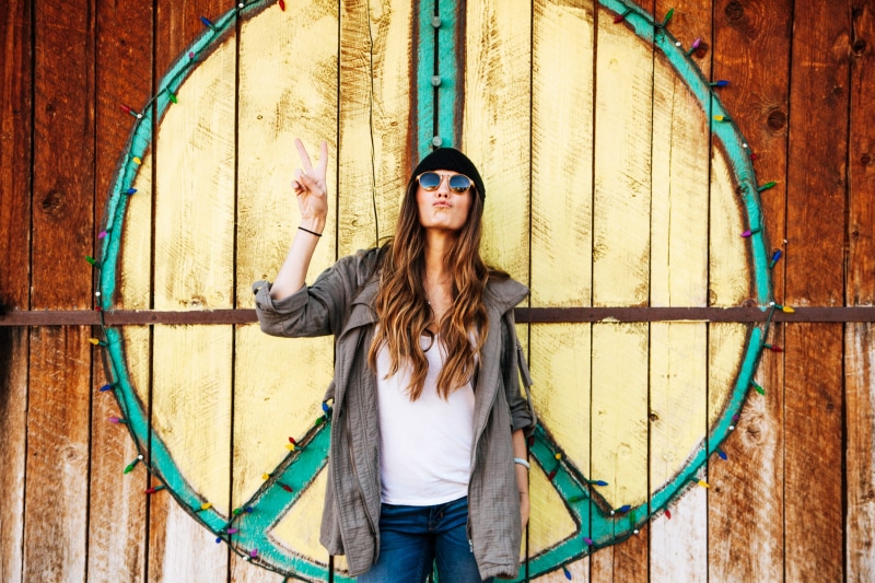 close-up, art, beanie, wood planks, woman, long hair, adult, cute, door, christmas lights, casual clothing, portrait, trendy, leisure activity, fashion