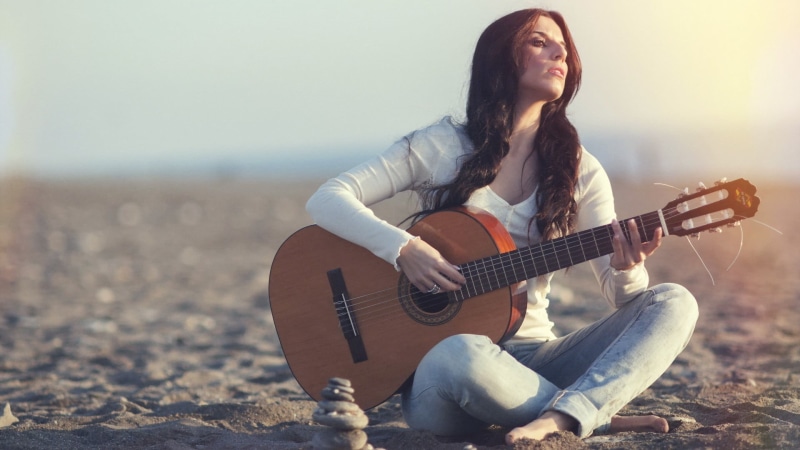 musician, hairstyle, women, hair, outdoors, one person, arts culture and entertainment, plucking an instrument, playing, acoustic guitar, freedom, land