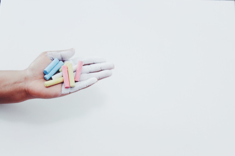 studio shot, holding, pastel, creative, school, creativity, assorted, frame, close-up, healthcare and medicine, indoors, person, backdrop, finger, body part