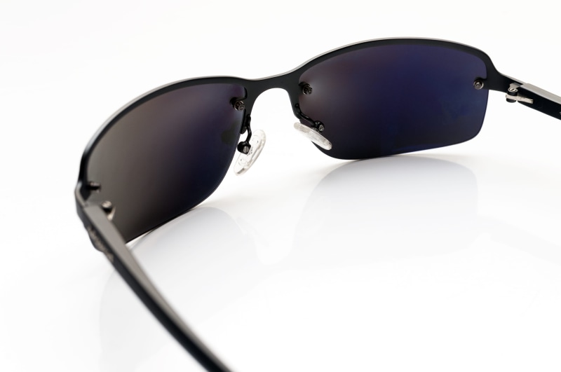 sunglass, single object, eyeglasses, indoors, glasses, lens, tinted, minimal, accessories, object, brand, dark, white background, product, glass, summer