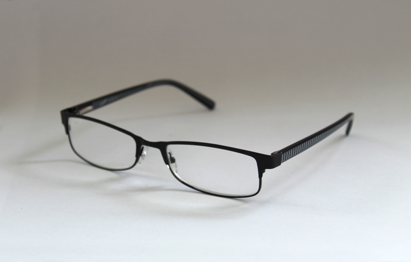 reading aid, reflection, black Color, copy space, indoors, lenses, no people, personal Accessory, single Object, see, table, elegance, white background