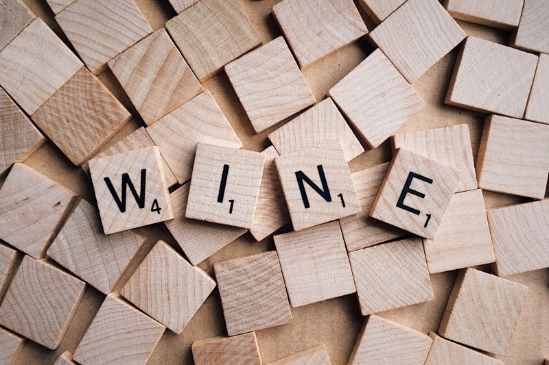 flat, communication, directly above, wood - material, text, studio shot, block shape, wine, message, day, abundance, letters, still life, cube shape, brown