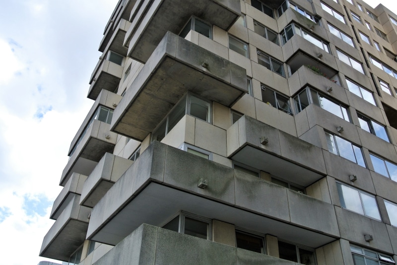 low angle view, day, flat, building exterior, city, 4K, architectural feature, building, urban, modern, no people, balconies, sky, window, pattern, sunlight