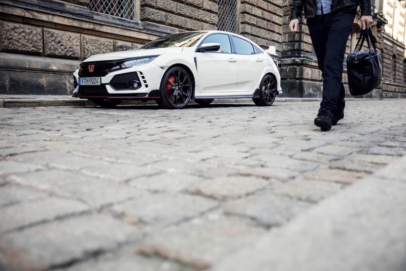 men, surface level, travel, car, selective focus, standing, honda civic type r, land vehicle, real people, motor vehicle, cobblestone, low section, outdoors
