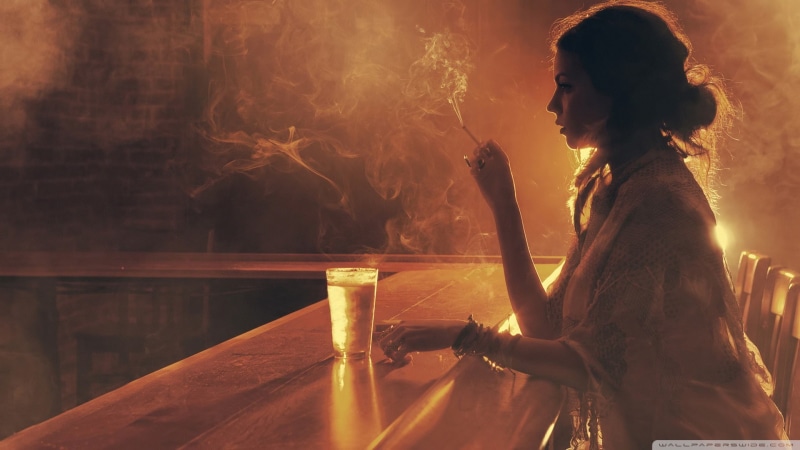 three quarter length, contemplation, drink, smoking, backlighting, leisure activity, hairbun, refreshment, women, smoke - physical structure, cigarette