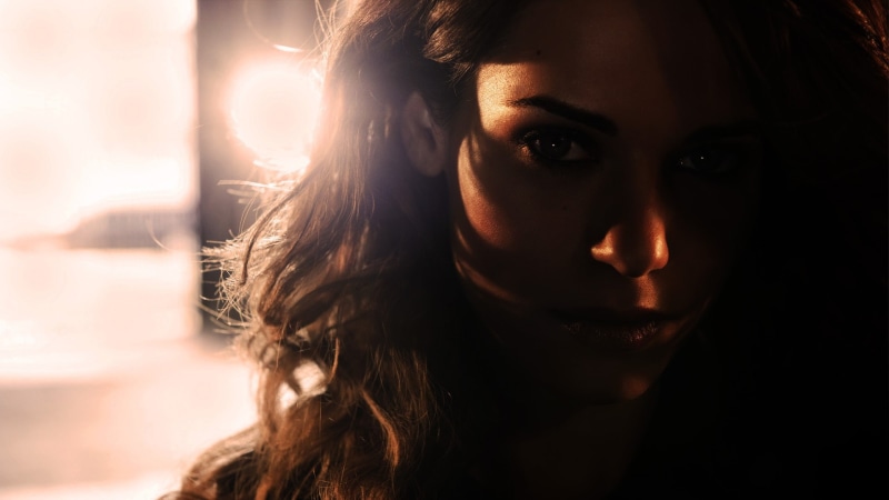 backlighting, lens flare, young adult, close-up, portrait, one person, body part, emotion, depression - sadness, human hair, beautiful people, brunette